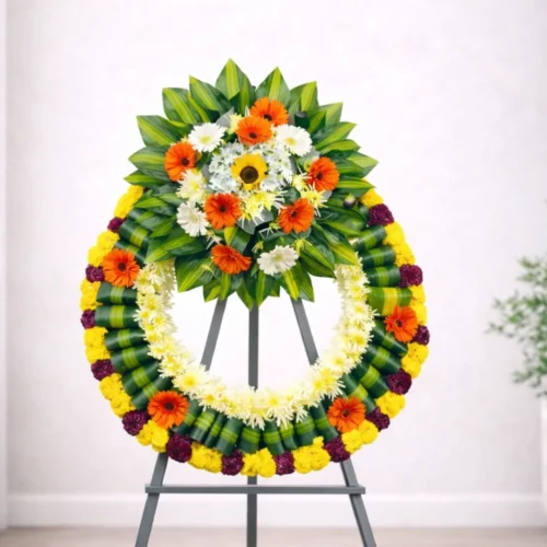 Corona para difunto diseño moderno anaranjado con amarillo y verde.