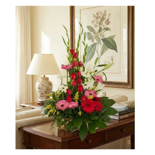 Imponente arreglo floral de altura con mezcla de gerberas, rosas y lirios. Ideal para impresionar en oficinas o casas.